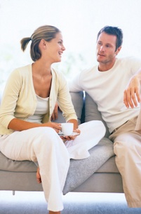 Couple on couch talking